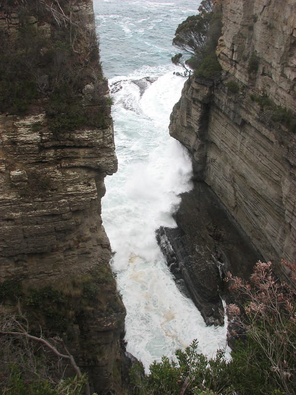 Devils Kitchen Tasmania, with strong waves.