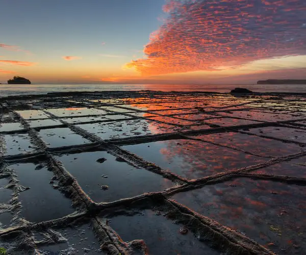 Sunrise and calm waters at Tessellated Pavement, in Eaglehawk Neck Tasmania
