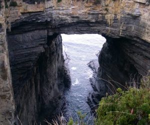 Tasmans Arch rock arch with water underneath